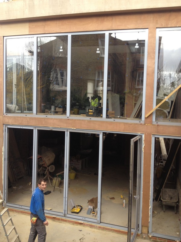 Aluminium bi-fold doors with two-storey glazing in Fulham