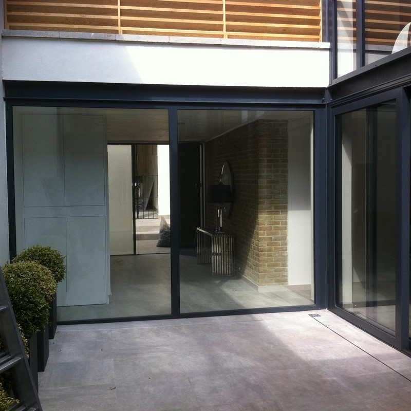 Floor-to-ceiling sliding doors opening to courtyard in Fulham