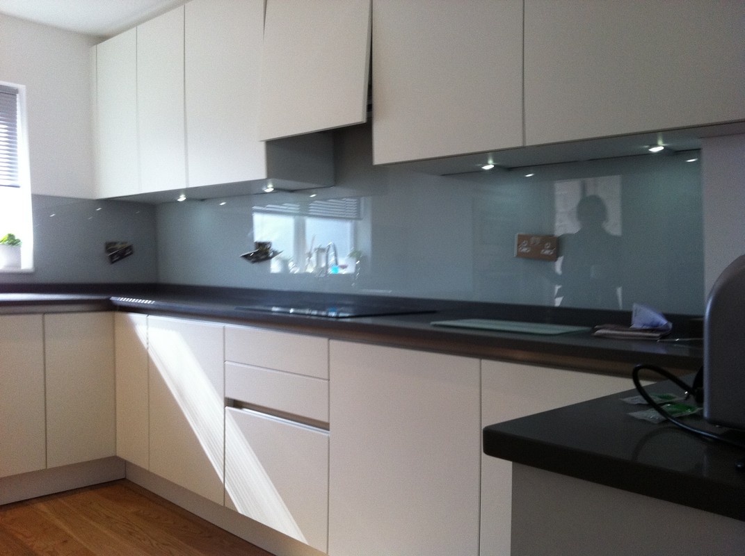 Grey glass kitchen splashback with LED lighting in Fulham